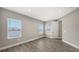 Bright bedroom offering wood-look tile flooring and lots of natural light at 12520 Brookgreen St, Venice, FL 34293