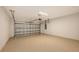 Spacious garage with speckled flooring and a modern garage door opener at 12520 Brookgreen St, Venice, FL 34293
