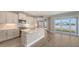 Modern kitchen with stainless steel appliances, center island, and sliding glass doors to outdoor patio at 12520 Brookgreen St, Venice, FL 34293
