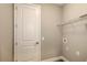 Functional laundry room featuring tile flooring, wire shelving, and appliances at 12520 Brookgreen St, Venice, FL 34293