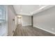 Living room featuring wood-look tile flooring, neutral walls, and recessed lighting at 12520 Brookgreen St, Venice, FL 34293