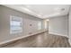 Bright living room featuring wood-look tile flooring, neutral walls, and recessed lighting at 12520 Brookgreen St, Venice, FL 34293