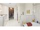 Bathroom features tub, shower, stone counters, and closet at 1538 S Orange Ave, Sarasota, FL 34239