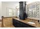 Bathroom features a double vanity with granite countertops and black cabinetry at 1538 S Orange Ave, Sarasota, FL 34239