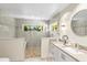 Bright bathroom featuring tile floors, stone counters, and glass enclosed shower at 1538 S Orange Ave, Sarasota, FL 34239