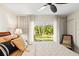 Bright bedroom features a sliding glass door at 1538 S Orange Ave, Sarasota, FL 34239