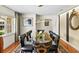 Formal dining area featuring elegant decor and large windows, perfect for entertaining guests at 1538 S Orange Ave, Sarasota, FL 34239