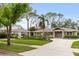 Charming single-story home boasting manicured landscaping, a brick driveway, and a matching carport at 1538 S Orange Ave, Sarasota, FL 34239