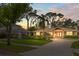 Charming single-story home boasting manicured landscaping, a brick driveway, and a matching carport at 1538 S Orange Ave, Sarasota, FL 34239