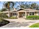 Welcoming home featuring a beautifully designed paver driveway and covered front entry at 1538 S Orange Ave, Sarasota, FL 34239