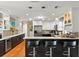 Modern kitchen with bar-style seating, pendant lights, and plenty of cabinet storage at 1538 S Orange Ave, Sarasota, FL 34239