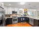 Modern kitchen featuring stainless steel appliances, stylish countertops, and ample cabinet space at 1538 S Orange Ave, Sarasota, FL 34239