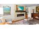 Modern living room with stylish decor, fireplace, flat screen TV, and sleek white sofa at 1538 S Orange Ave, Sarasota, FL 34239