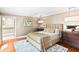 Comfortable main bedroom featuring neutral tones, ample closet space, and wood floors at 1538 S Orange Ave, Sarasota, FL 34239