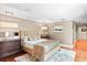 Serene main bedroom with hardwood floors, neutral tones, and a large bed with decorative pillows at 1538 S Orange Ave, Sarasota, FL 34239