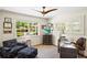 Home office with custom desk, sitting area and natural light at 1538 S Orange Ave, Sarasota, FL 34239