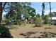 Spacious backyard with chain link fence and mature trees creating a private outdoor retreat at 1711 30Th W St, Bradenton, FL 34205