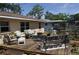 Inviting backyard deck is a great place for relaxation and outdoor entertaining with seating and potted plants at 1711 30Th W St, Bradenton, FL 34205