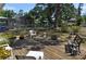 Wooden deck offers a seating area with a view of the fenced backyard and screened lanai at 1711 30Th W St, Bradenton, FL 34205
