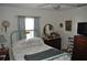 Comfortable bedroom featuring full bed, ceiling fan, and vintage decor at 1711 30Th W St, Bradenton, FL 34205