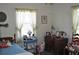 Cozy bedroom featuring a twin bed, vintage decor, and natural light streaming through the window at 1711 30Th W St, Bradenton, FL 34205