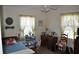 Charming bedroom with twin bed, a ceiling fan, and a vintage aesthetic at 1711 30Th W St, Bradenton, FL 34205