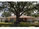 Charming single-story residence with well-maintained lawn, mature trees, and attached garage at 1711 30Th W St, Bradenton, FL 34205