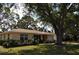 Inviting single-story home featuring a cozy facade and lush landscaping in a serene neighborhood at 1711 30Th W St, Bradenton, FL 34205