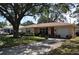 Charming single-story home with a well-manicured front yard and mature trees for shade at 1711 30Th W St, Bradenton, FL 34205