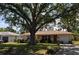Well-maintained front yard with mature shade tree and single car garage offers a delightful curb appeal at 1711 30Th W St, Bradenton, FL 34205