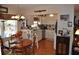 Charming kitchen with white cabinetry, granite countertops, and a cozy dining area at 1711 30Th W St, Bradenton, FL 34205