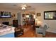 Spacious living room featuring fireplace, hardwood floors, and a view into the dining area at 1711 30Th W St, Bradenton, FL 34205