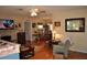 Open-concept living area featuring hardwood floors, fireplace, and dining area at 1711 30Th W St, Bradenton, FL 34205