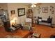 Comfortable living room featuring a recliner, bench seating, and decorative wall art at 1711 30Th W St, Bradenton, FL 34205