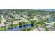 Overhead community view showcases a pond surrounded by homes and lush landscaping at 1727 88Th Nw Ct, Bradenton, FL 34209