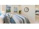 Cozy bedroom showing a bright window and artwork, adjacent to the ensuite at 1727 88Th Nw Ct, Bradenton, FL 34209