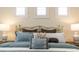 Detailed shot of the bedroom's plush bedding, stylish pillows, and bedside tables at 1727 88Th Nw Ct, Bradenton, FL 34209