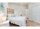 Well-lit bedroom with hardwood floors, a decorative headboard, and ample closet space offering comfort and style at 1727 88Th Nw Ct, Bradenton, FL 34209
