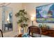 Close-up of dining room decor with modern art and a stylish bamboo plant, enhancing the room's ambiance at 1727 88Th Nw Ct, Bradenton, FL 34209