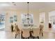Sunny dining room with direct view of the pool and backyard at 1727 88Th Nw Ct, Bradenton, FL 34209
