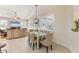 Dining room with shuttered windows, modern light fixture and seamless living area at 1727 88Th Nw Ct, Bradenton, FL 34209
