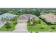Beautifully landscaped home with a two-car garage and a serene lake view, creating an inviting curb appeal at 1727 88Th Nw Ct, Bradenton, FL 34209