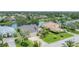 Attractive home features a well-maintained lawn, mature trees, and a tranquil lake in the backyard at 1727 88Th Nw Ct, Bradenton, FL 34209
