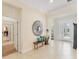 Spacious foyer with tile flooring, stylish mirror, and ample natural light at 1727 88Th Nw Ct, Bradenton, FL 34209