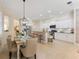 Open-concept living area with dining and kitchen; great for entertaining at 1727 88Th Nw Ct, Bradenton, FL 34209