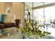 Close up view of a living room's glass table decorated with wine and glasses at 1727 88Th Nw Ct, Bradenton, FL 34209