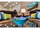 Close up of a decorative bowl on glass table in living room with beach-themed accents at 1727 88Th Nw Ct, Bradenton, FL 34209