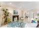 Cozy living room with a decorative fireplace, comfortable seating and plenty of natural light at 1727 88Th Nw Ct, Bradenton, FL 34209