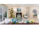 Comfortable living room with decorative rug, elegant fireplace, and ample seating at 1727 88Th Nw Ct, Bradenton, FL 34209