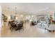Open-concept living and dining area with tile floors and bright, airy atmosphere at 1727 88Th Nw Ct, Bradenton, FL 34209